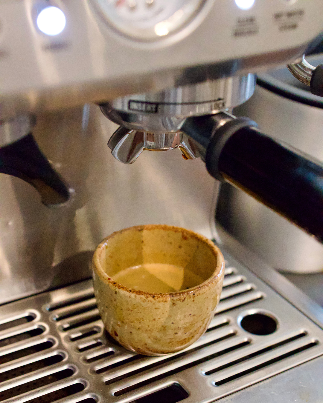 Espresso shot in a handmade ceramic espresso cup